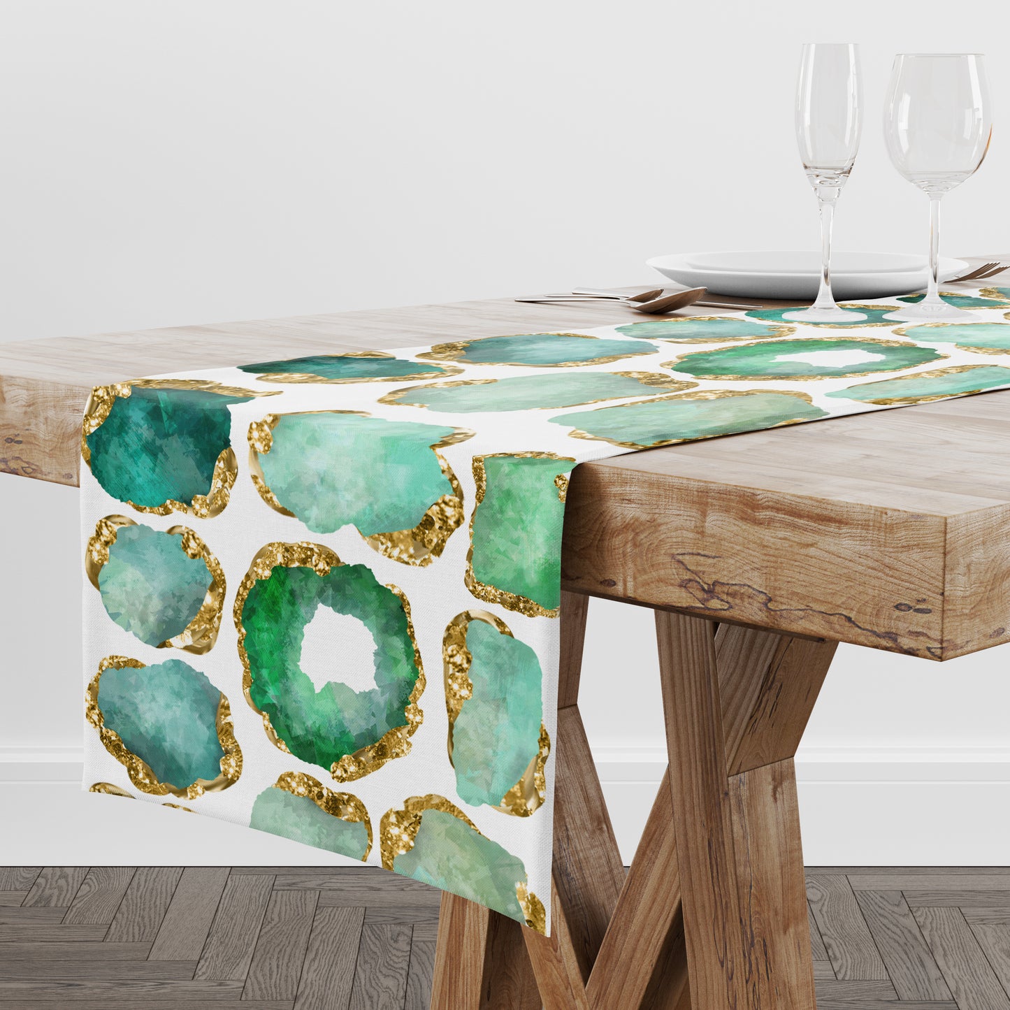 Table runner with green and gold agate design on a wooden table