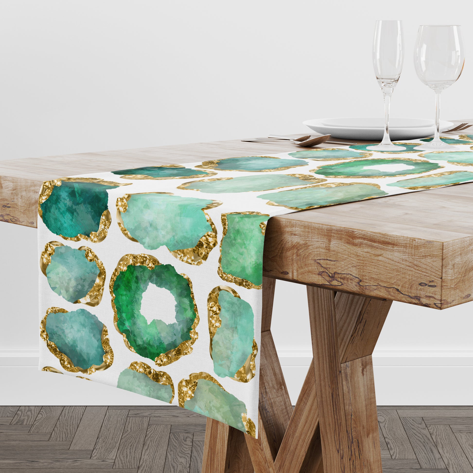 Table runner with green and gold agate design on a wooden table