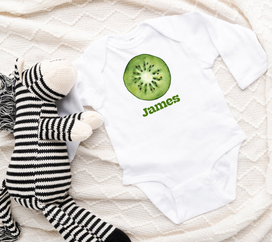 White baby onesie with a printed kiwi graphic and personalized custom text of your choice.