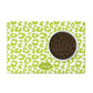 Personalized dog bowl mat in a leaf green and white leopard print.