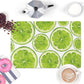 Lime kitchen counter mat has colorful sliced limes printed on moisture wicking polyester mat with nonskid rubber back.