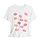 White t-shirt with colorful lip prints on a white background