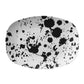 White serving platter with black paint splatter pattern on a white background