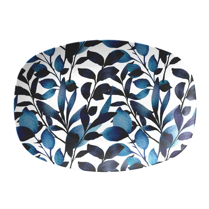 Oval serving platter with modern leaf print in navy blue and white