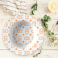 Personalized White and Orange Stylized Monogram Bowl Set features customized initials set in a repeating pattern accented with a stylish motif for an all-over, unique custom design.