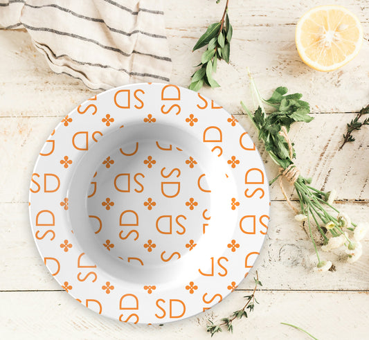 Personalized White and Orange Stylized Monogram Bowl Set features customized initials set in a repeating pattern accented with a stylish motif for an all-over, unique custom design.