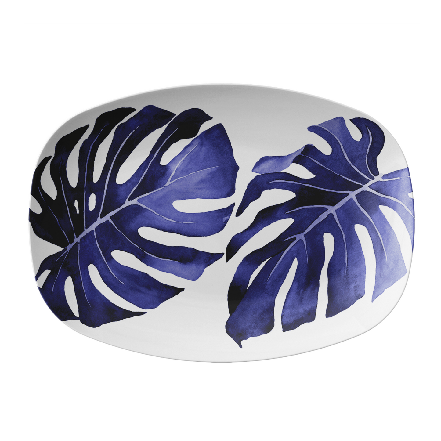 Oval white serving platter with blue banana leaf pattern on a white background