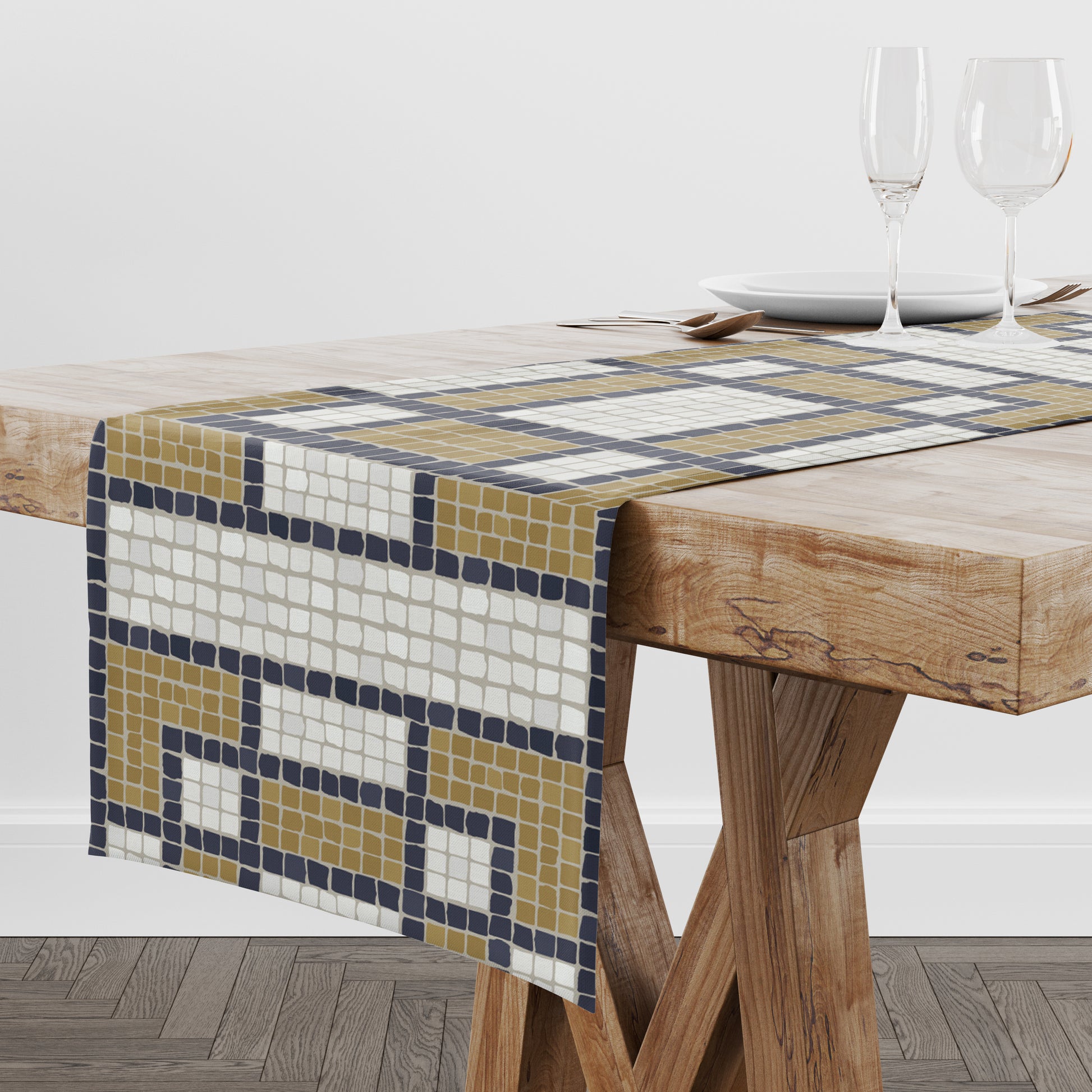Mosaic tile table runner in cream, black and gold checked pattern on a wooden table