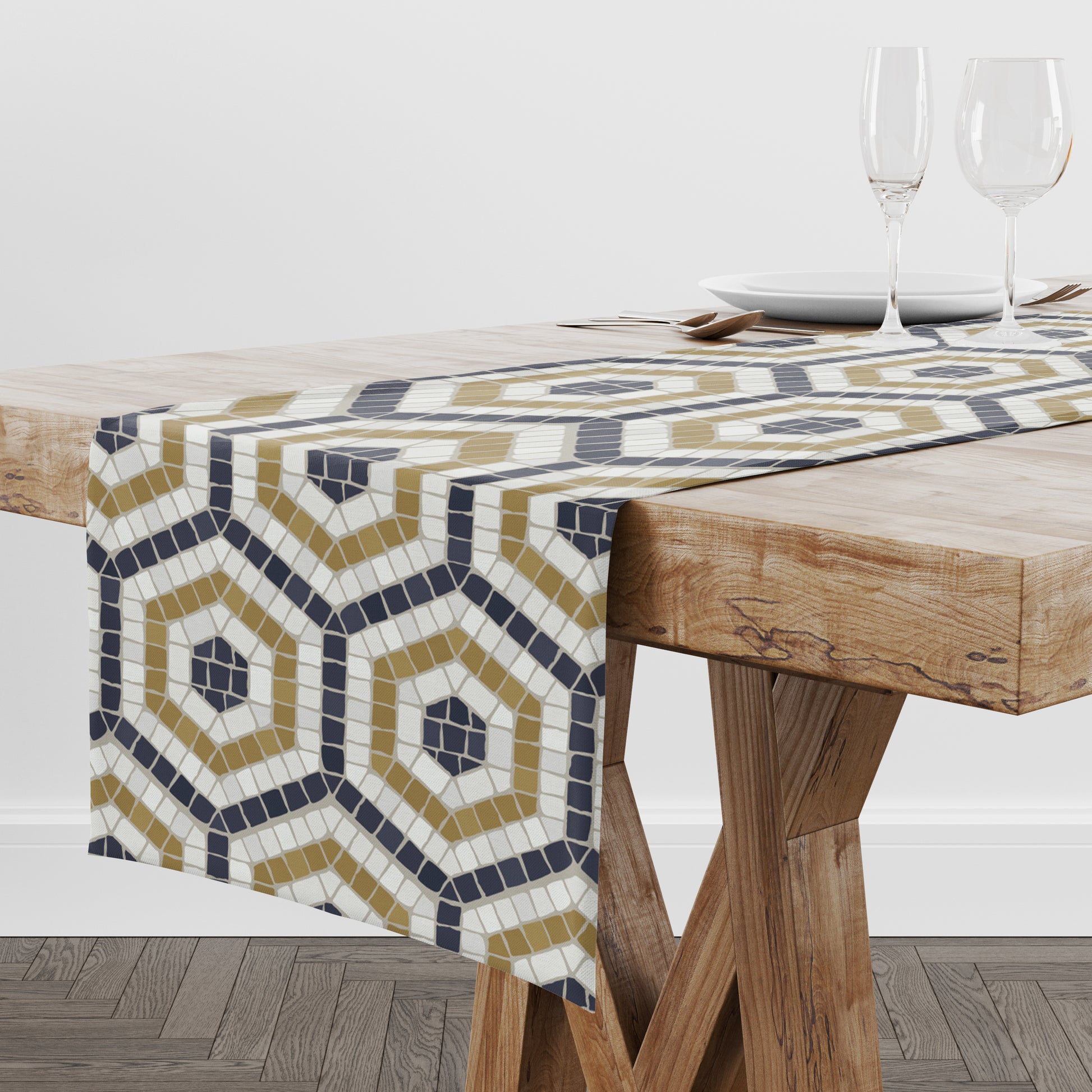 Mosaic tile table runner in black, gold and cream in a hexagon pattern on a wood dining table