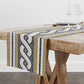 Table runner with geometric bistro tile stripe pattern on a wooden table