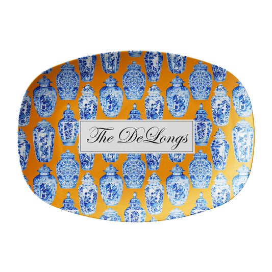 Chinoiserie inspired serving platter in blue, orange and white has ginger jars printed on it and can be personalized with any name or word.