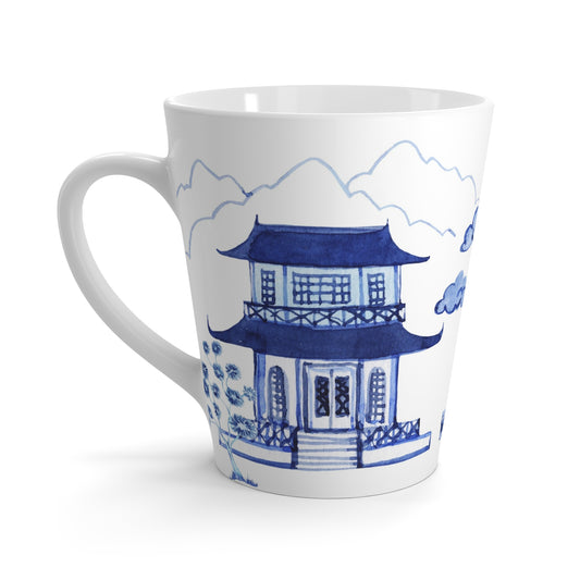 White ceramic mug with blue pagoda design on a white background