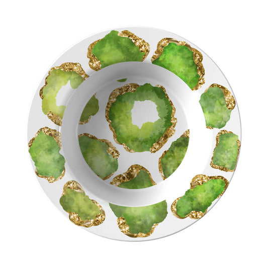 Rim soup style bowl has green and gold crystal gemstones printed on a white background