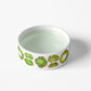 White heavy ceramic spill proof dog bowl with green and gold gemstone print
