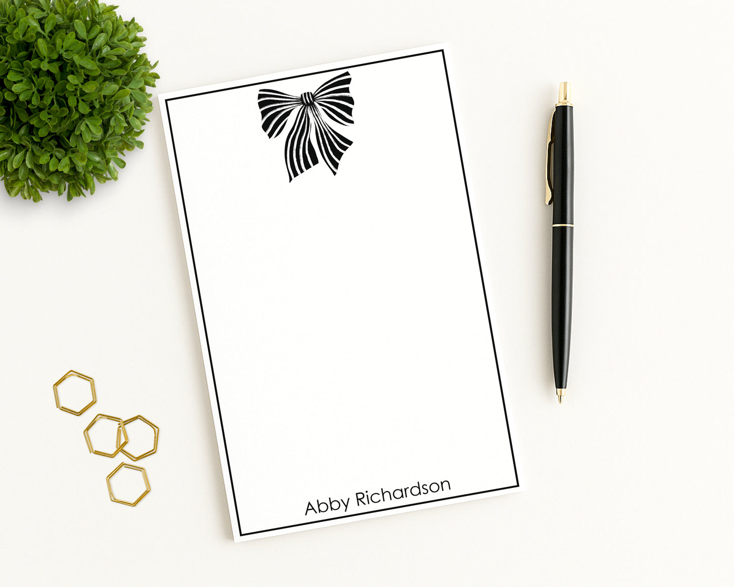 Notepad with striped fashion bow motif, border, custom name and desk accessories
