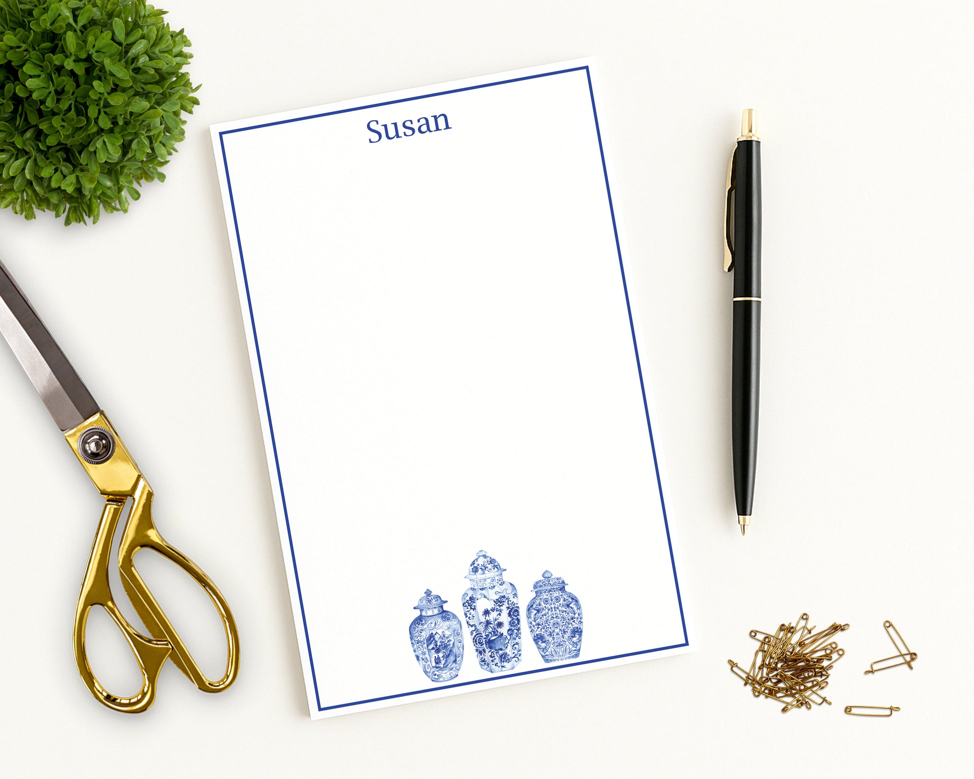 Writing notepad with ginger jar  motifs and custom name shown with desk accessories