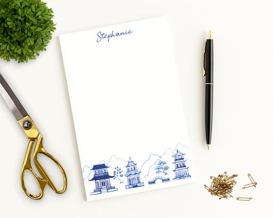 Notepad with custom name, decorative blue and white chinoiserie pagodas design, and desk accessories