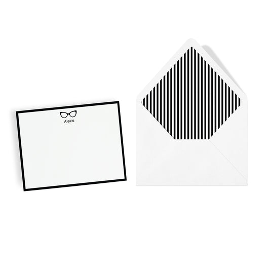 Personalized note card with black cat eye eyewear frames icon and custom text with a striped envelope on a white background