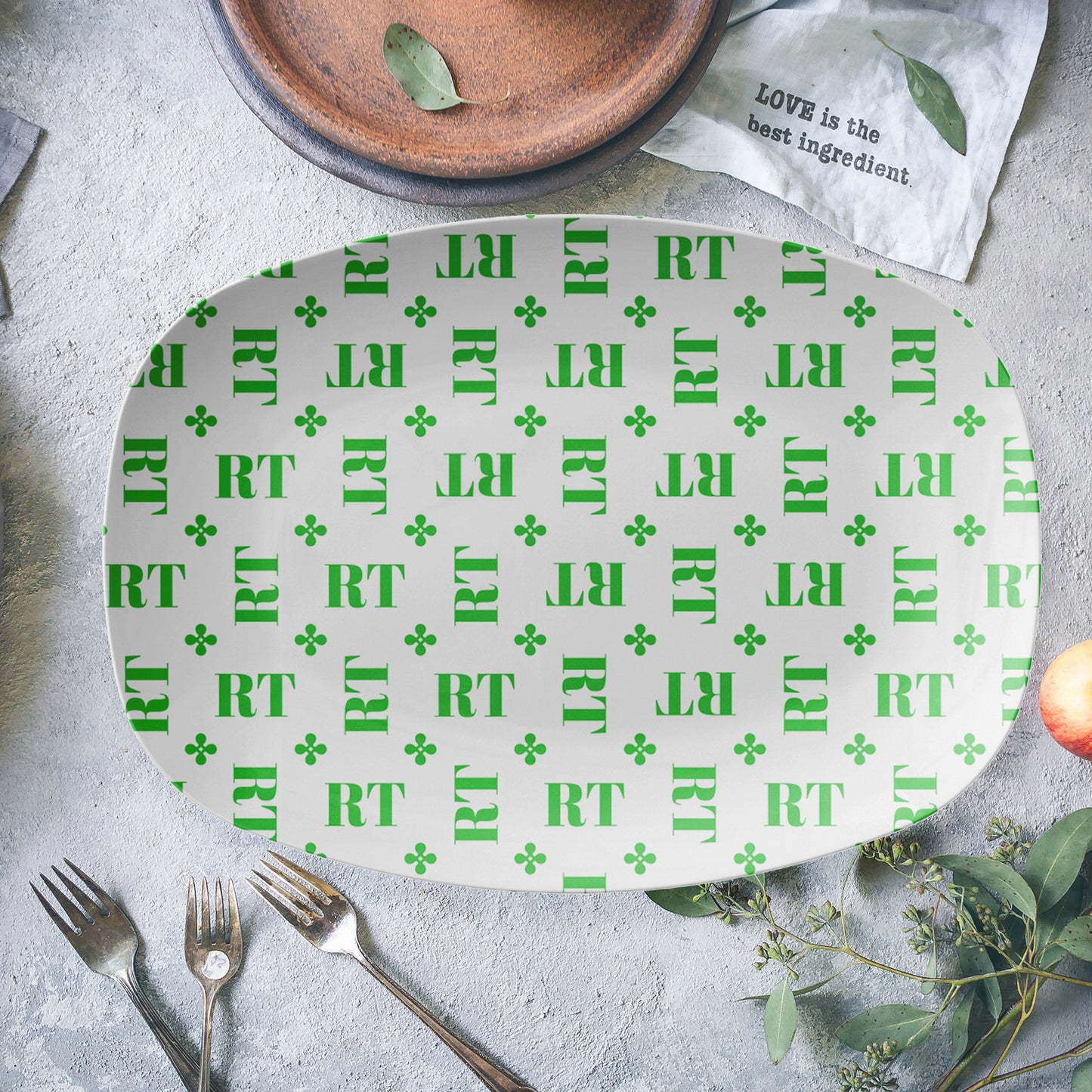 Personalized White and Green Stylized Monogrammed Platter features customized initials set in a repeating pattern accented with a stylish motif for an all-over, unique design.