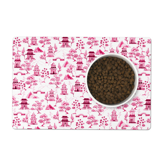 Pink chinoiserie toile pet feeding mat. Polyester top, nonskid rubber back. Machine washable.