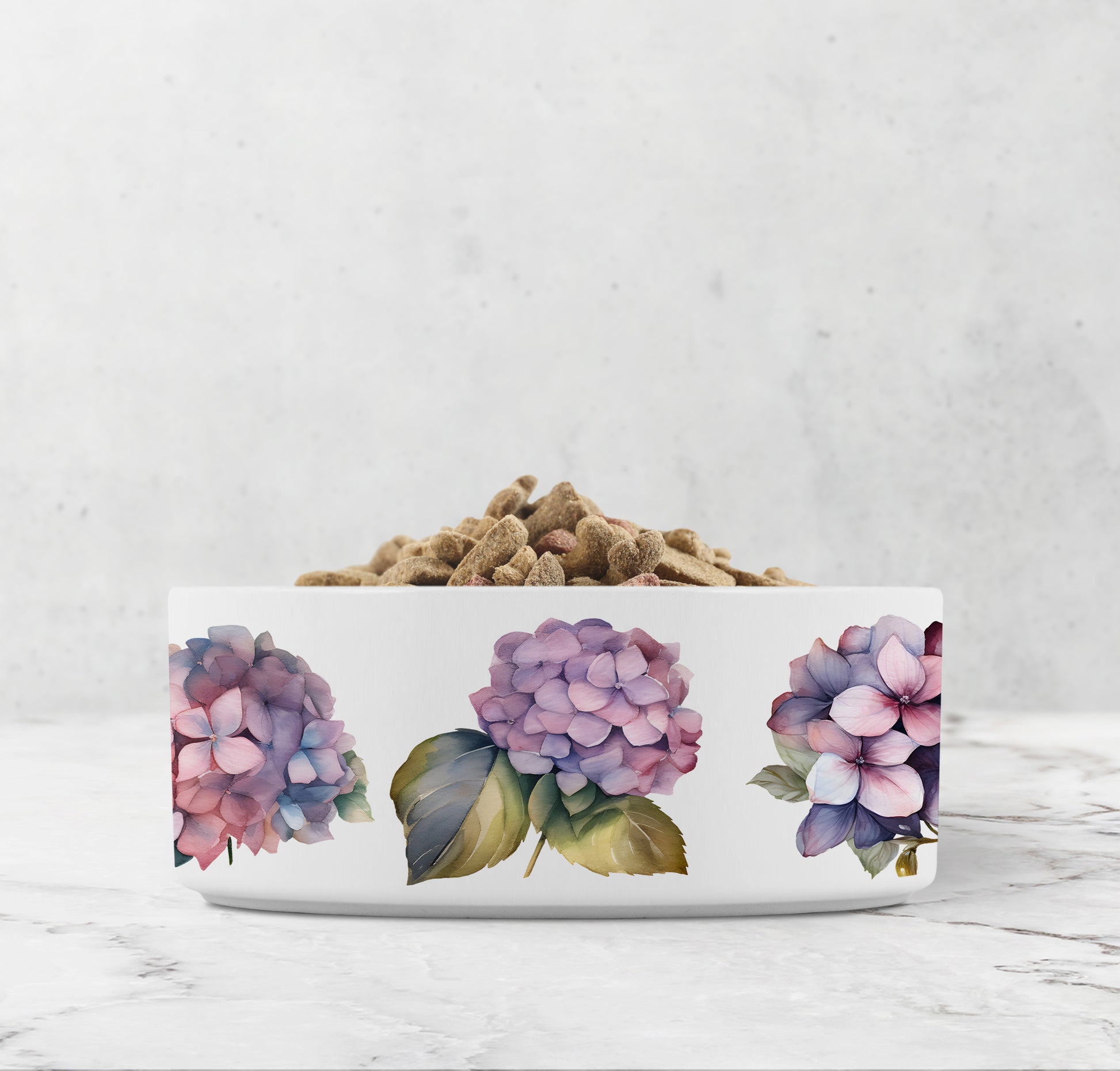 White pet bowl with floral design on a marble surface