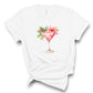 Glamorous tshirt for women has a gorgeous holiday cocktail graphic print. Available in white or black tee. Pink cocktail features a pretty pink poinsettia garnish.