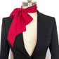 Black blazer with a red bow scarf on a mannequin against a white background