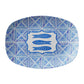 Blue and white tile patterned platter with fish design and 'Sardines' text on a white background