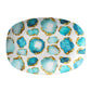Gemstone print oval serving platter features aquamarine jewels with gold accents on white