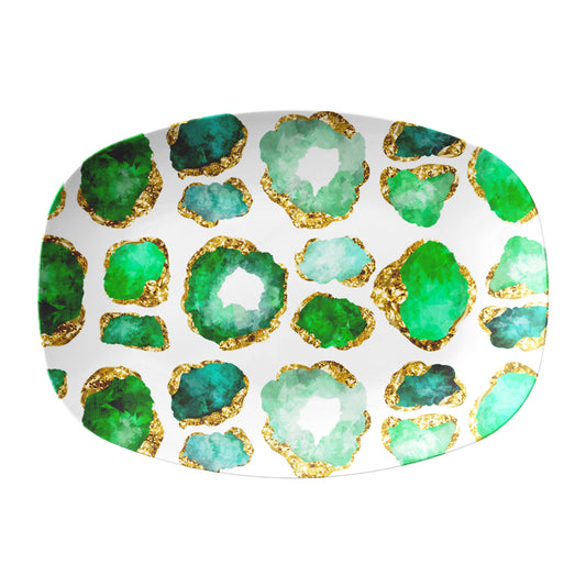 Oval serving platter with green and gold abstract design on a white background.