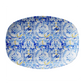 Oval platter with blue and white floral pattern with tigers on a white background