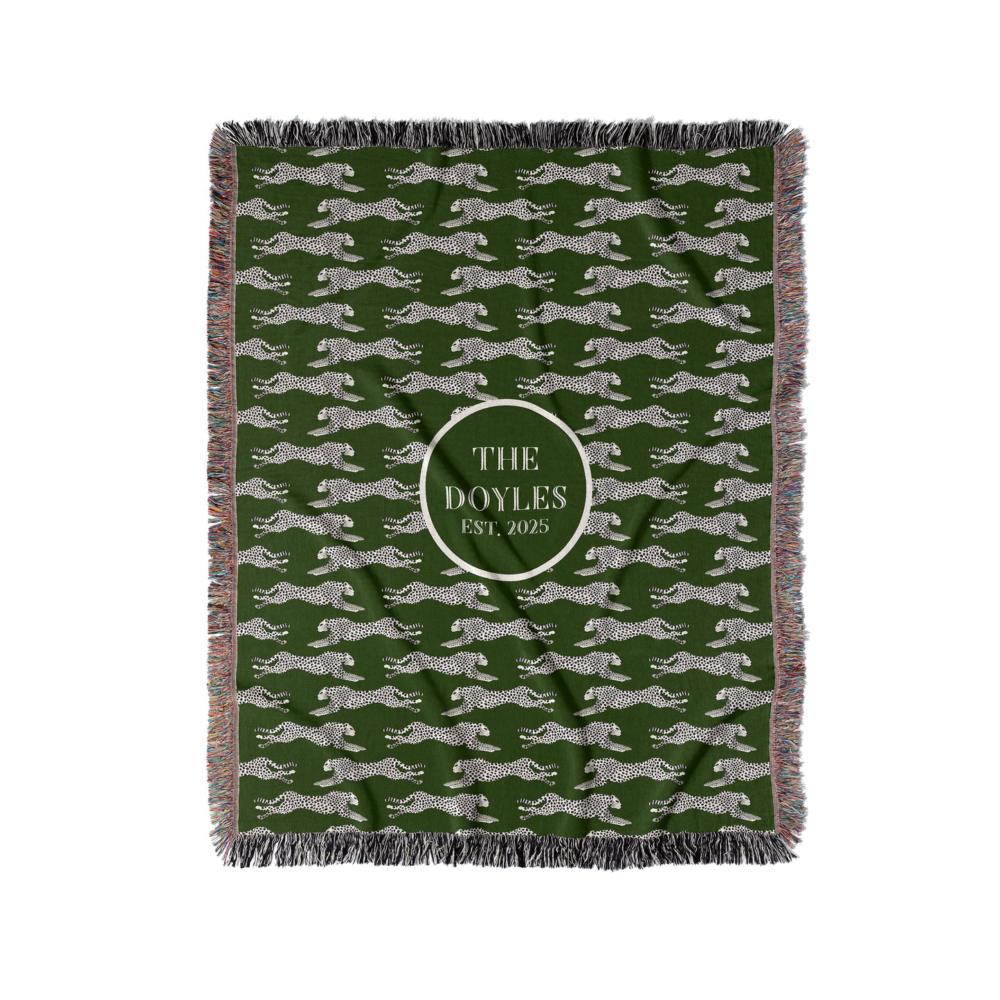 Black and cream cheetahs are woven into a dark green woven blanket or throw. Personalize with any custom text in center.