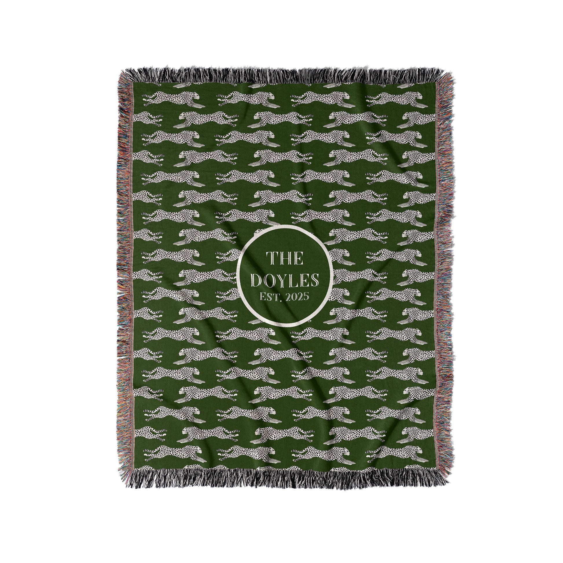 Black and cream cheetahs are woven into a dark green woven blanket or throw. Personalize with any custom text in center.