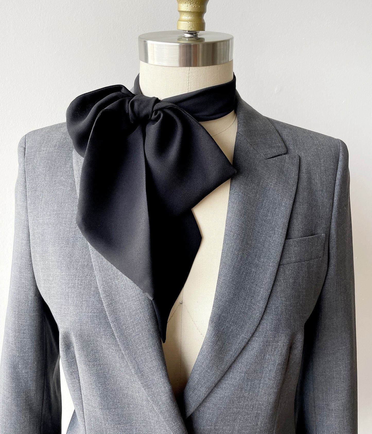 A men's scarf, i.e. a long silk scarf, is a versatile accessory