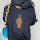 Peace Sign print t-shirt for women. Classic crewneck short sleeve tee features a hand wearing a glamorous aqua ring and a fabulous light blue manicure showing the peace sign. Fantastic gift for her.