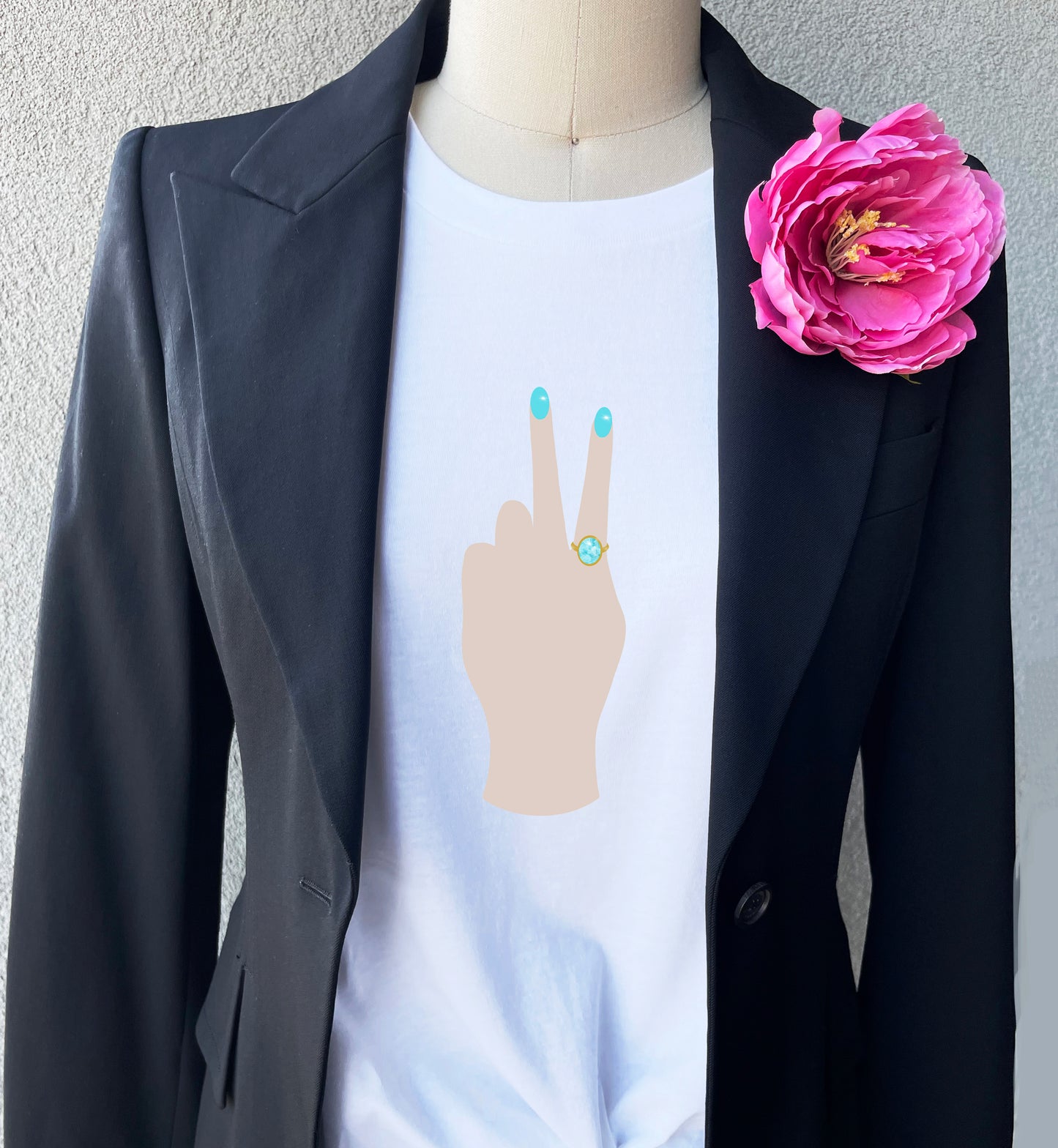 Peace Sign print t-shirt for women. Classic crewneck short sleeve tee features a hand wearing a glamorous aqua ring and a fabulous light blue manicure flashing the peace sign.