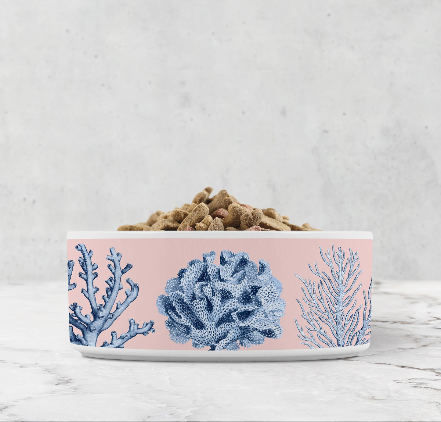 Ceramic dog bowl with gorgeous blue coral reef printed on pale pink background