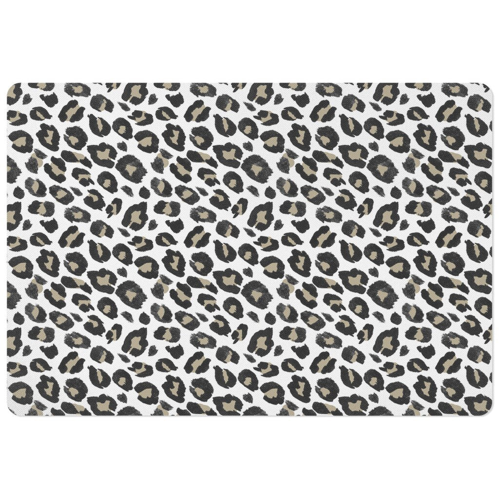 Rectangle pet food mat with black tan and white leopard spots animal print.