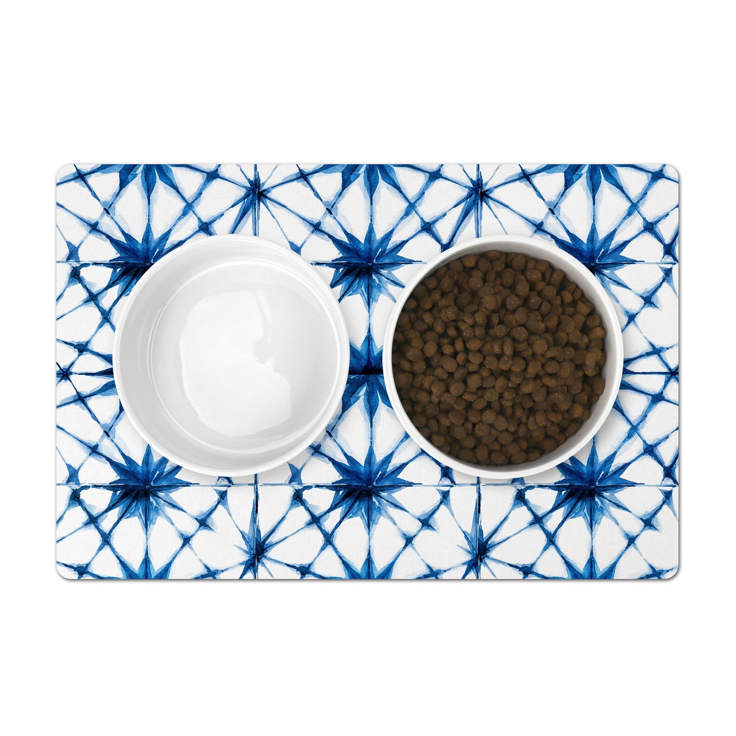 Pet food mat with indigo blue shibori tie dye print for pet food bowls.