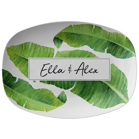 Green banana leaves are printed on this white serving platter. Personalize it with any name, word or initials.