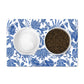 Pet mat with pretty blue and white floral batik print to place under pet food bowls.