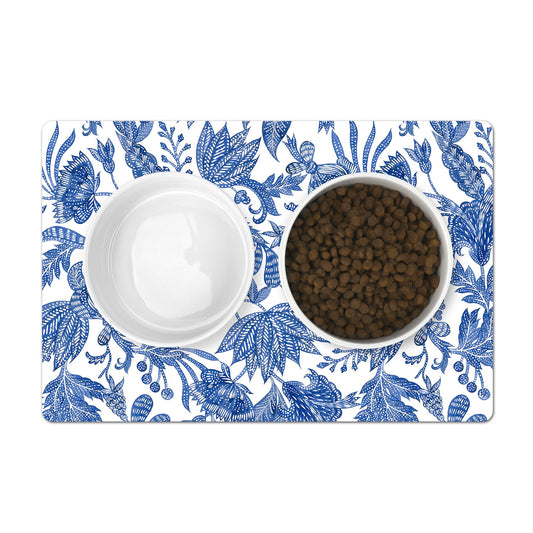 Pet mat with pretty blue and white floral batik print to place under pet food bowls.
