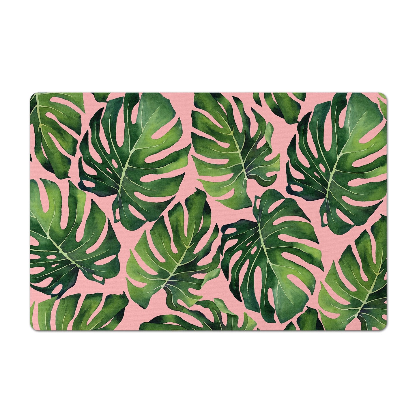 Pet food mat with green monstera leaf print on pink.