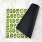 Pet Placemat has gemstone print in green & gold with black rubber backing.